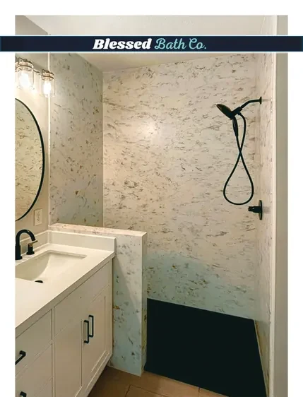 Walk-in shower with a matte black handheld showerhead next to a new vanity
